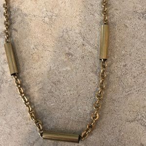 This faux gold necklace is dated to mid century.